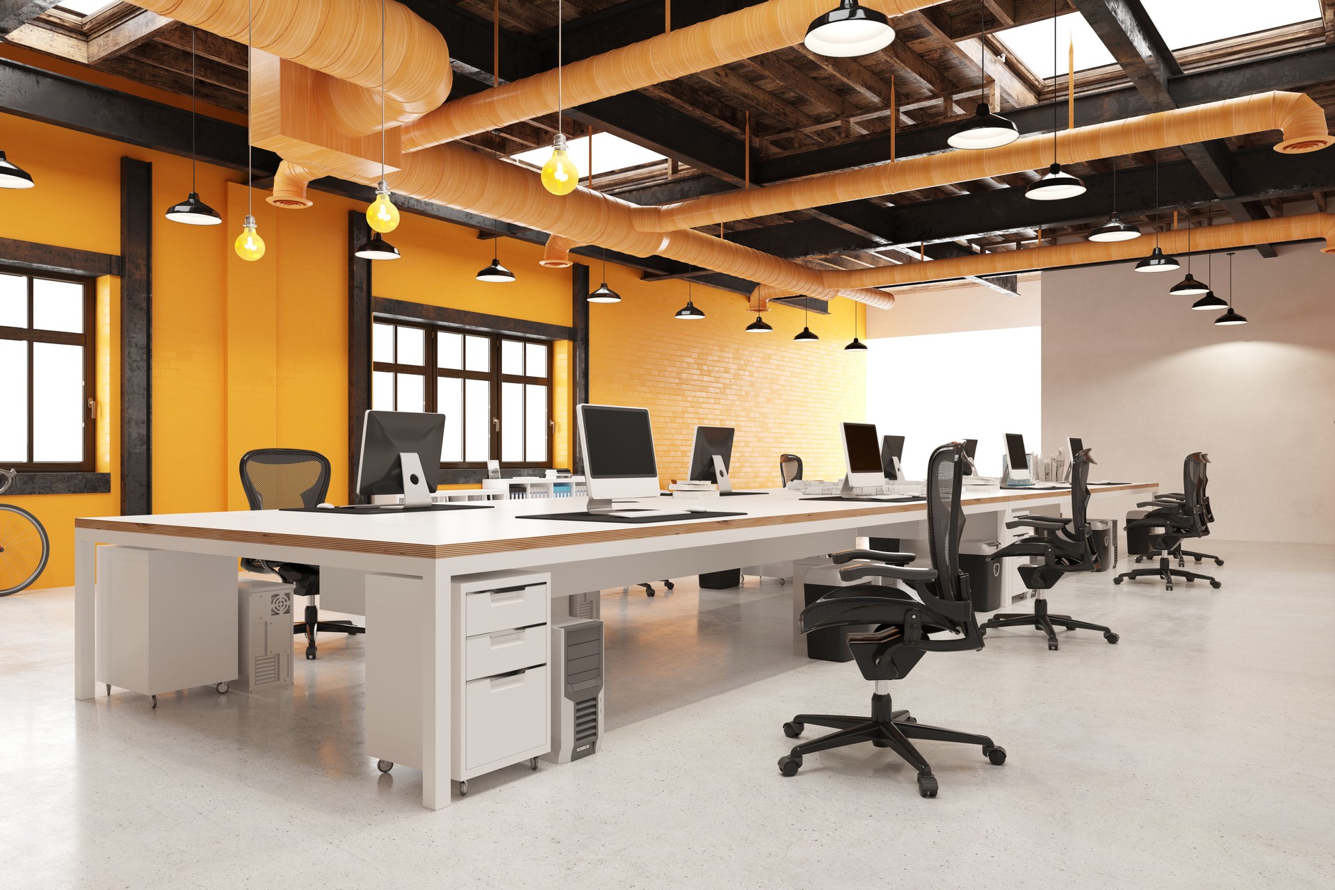 Modern industrial loft office interior. 3D rendering of an empty open-plan workplace with desks and computers.